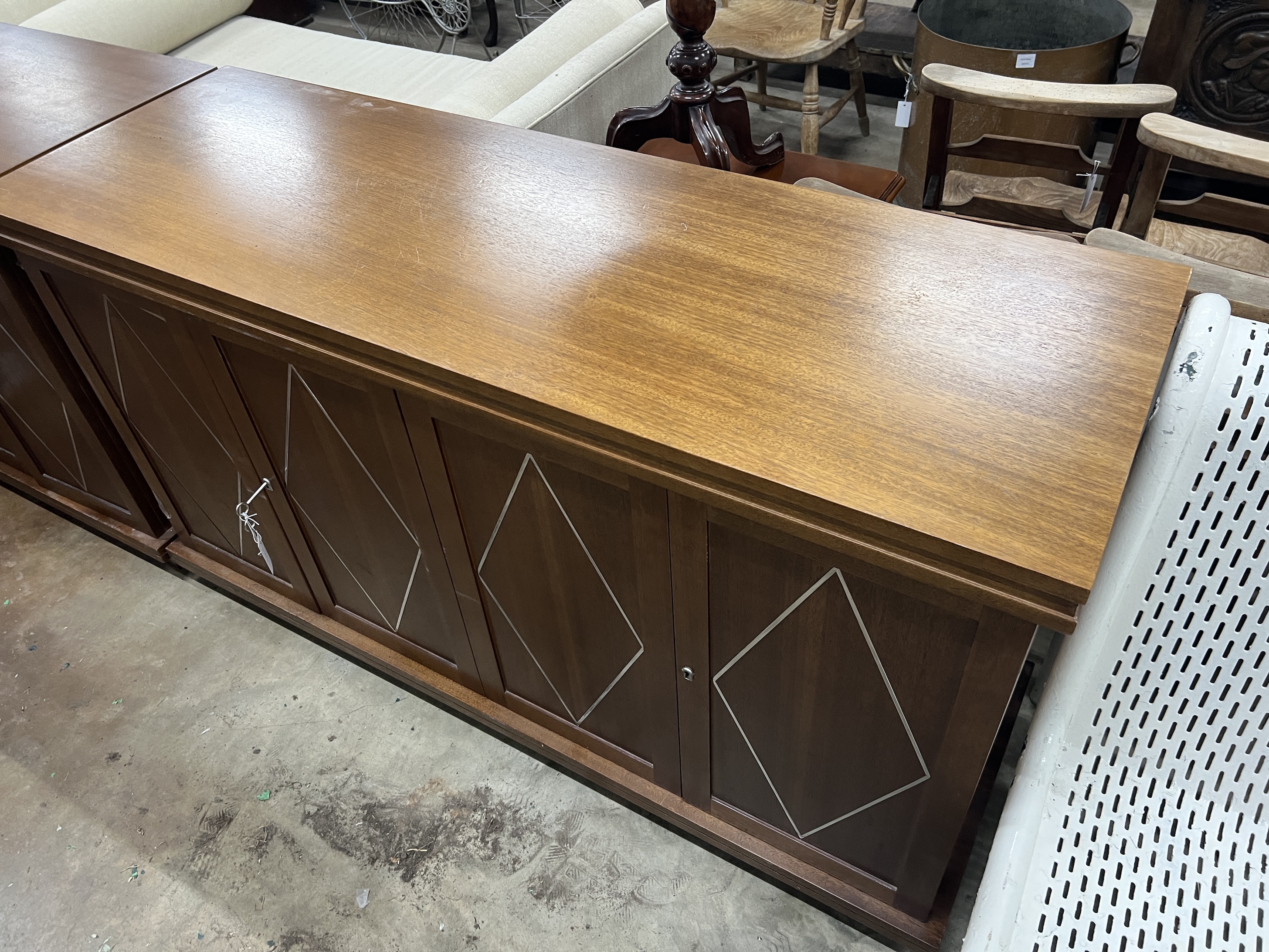 A contemporary South African mahogany chrome inlaid side cabinet, width 150cm, depth 50cm, height 85cm